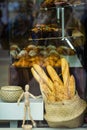 Bakery Showcase. Freshly baked bread and rolls, traditional french pastries. Wicker basket with fresh crispy baguettes Royalty Free Stock Photo