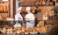 Bakery staff offering bread Royalty Free Stock Photo