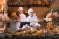 Bakery staff offering bread Royalty Free Stock Photo