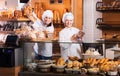 Bakery staff offering bread Royalty Free Stock Photo