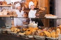 Bakery staff offering bread Royalty Free Stock Photo