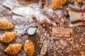 At the bakery, still life with mini Croissants, bread, milk, nuts and flour Royalty Free Stock Photo