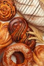 Bakery - various kinds of breadstuff. Bread rolls, bagel, sweet bun. Vertical photo