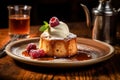 Bakewell pudding served with finesse on a rustic wooden table. Royalty Free Stock Photo