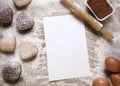 Baking background with blank sheet of paper for the recipe or menu  heart shaped cookies  eggs  flour and rolling pin Royalty Free Stock Photo