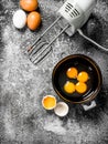 Baking background. Blend eggs with a mixer to make a dough. Royalty Free Stock Photo