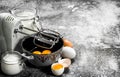 Baking background. Blend eggs with a mixer to make a dough. Royalty Free Stock Photo