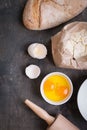 Baking background with bread, eggshell, flour, rolling pin Royalty Free Stock Photo