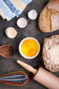 Baking background with bread, eggshell, flour, rolling pin Royalty Free Stock Photo