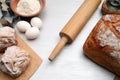 Baking background with cutting board, egg, bread, flour, rolling pin Royalty Free Stock Photo