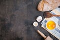 Baking background with eggshell, bread, flour, rolling pin Royalty Free Stock Photo