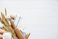 Baking background with flour, wheat ears and rolling pinon concrete background. Top view with copy space Royalty Free Stock Photo