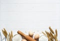 Baking background with flour, wheat ears and rolling pinon concrete background. Top view with copy space Royalty Free Stock Photo