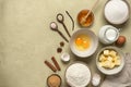 Baking background. Baking ingredients are flour, butter, milk, spices, eggs, sugar and honey. Concrete beige background. Top view Royalty Free Stock Photo