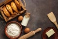 Baking background, ingredients for cooking pies, flour, butter, milk, eggs. Traditional Russians baked patties, pirozhki Royalty Free Stock Photo