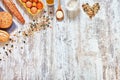 Baking background. Mix of fresh bread and ingredients on a wooden table. Royalty Free Stock Photo