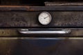 old oven thermometer at bakery shop Royalty Free Stock Photo