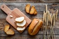 Baking bread with wheat flour and ears on table rystic background top view