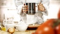 Baking a cake and bread. ChefÃ¢â¬â¢s female hands preparing food in the kitchen. Woman in white chef uniform. Royalty Free Stock Photo