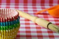Baking cases and pretty tablecloth Royalty Free Stock Photo