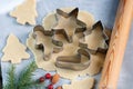 Baking Christmas cookies - dough on the table, cookie cutters and cookies Royalty Free Stock Photo