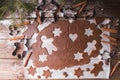 Baking Christmas cookies. Roll out the dough to cut out stars and gingerbreadman on a wooden background.