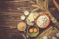 Baking concept - baking ingredients butter, flour, sugar, eggs on rustic wood background Royalty Free Stock Photo