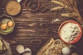 Baking concept - baking ingredients butter, flour, sugar, eggs on rustic wood background Royalty Free Stock Photo