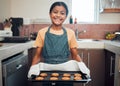 Baking, cookies and girl portrait happy about food, learning and youth helping in the kitchen and home. Cooking, house Royalty Free Stock Photo
