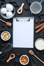 Baking cooking Ingredients on black background. Top view. Blank clipboard copy space. Home baking: cookies, bread, cake Royalty Free Stock Photo