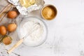 Baking and cooking ingredients on white marble background Royalty Free Stock Photo