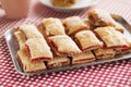 Baking crispy toast with sugar and strawbery jam Royalty Free Stock Photo