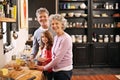 Baking day with Nan and Gramps. Portrait of a little girl and her grandparents baking together in the kitchen. Royalty Free Stock Photo