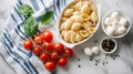 Baking dish of raw conchiglie pasta with cheese, tomatoes and spinach on light background Royalty Free Stock Photo