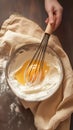 Baking essentials Eggs whisked in a bowl on rustic table Royalty Free Stock Photo