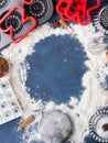 Baking flour frame on dark blue with tools ingredients