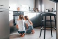 Baking food. Little boy and girl preparing Christmas cookies on the kitchen Royalty Free Stock Photo