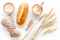 Baking fresh wheaten bread on bakery work table background top view