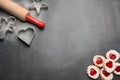 Baking heart-shaped Christmas cookies filled strawberry jam