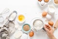 Baking homemade bread on white kitchen worktop with ingredients for cooking, culinary background, copy space Royalty Free Stock Photo