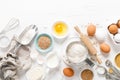 Baking homemade bread on white kitchen worktop with ingredients for cooking, culinary background, copy space Royalty Free Stock Photo