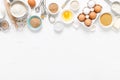 Baking homemade bread on white kitchen worktop with ingredients for cooking, culinary background, copy space Royalty Free Stock Photo