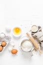 Baking homemade bread on white kitchen worktop with ingredients for cooking, culinary background, copy space Royalty Free Stock Photo