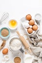 Baking homemade bread on white kitchen worktop with ingredients for cooking, culinary background, copy space Royalty Free Stock Photo