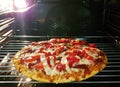 Baking of homemade pizza in oven Royalty Free Stock Photo