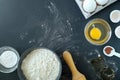 Baking ingredients and baking utensils on a black background Royalty Free Stock Photo