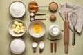 Baking ingredients on a beige concrete background. View from above