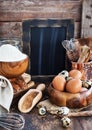 Baking ingredients and blackboard on background, rustic style