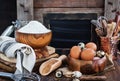 Baking ingredients and blackboard on background