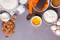 Baking ingredients for a carrot cake flour, butter, brown sugar, grated carrots, walnuts and other Royalty Free Stock Photo